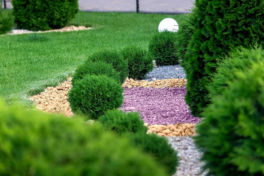 Pretty garden with decorative gravel flower boarders